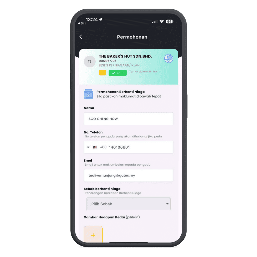 Laptop screen displaying myPATIL Portal for business permit application with user interface fields and status indicators.