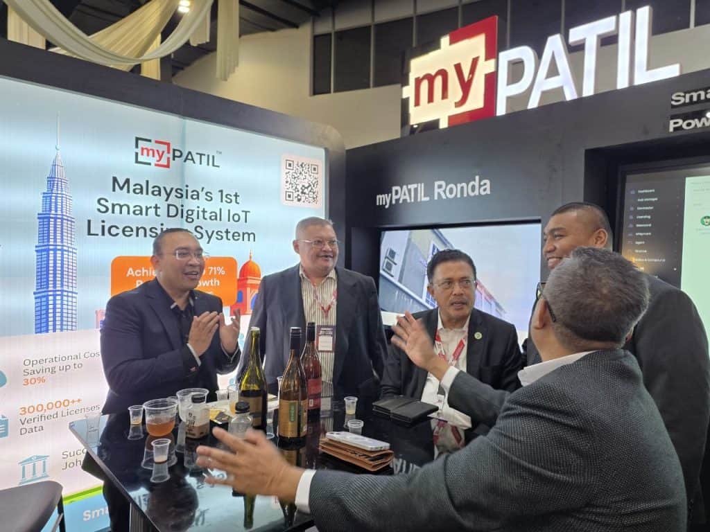MyPATIL Portal display at a trade show showcasing Malaysia's 1st Smart Digital IoT Licensing System for enhanced operational efficiency and digital transformation.